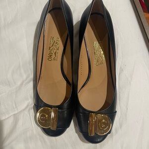Salvatore Ferragamo Black and Gold Heels with Decorative Medallion